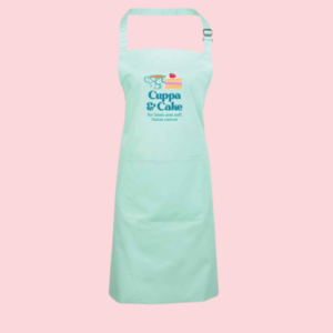 Light blue apron with an animated slice of cake and cup of tea on it and the writing ' Cuppa & Cake, for bone and soft tissue cancer'