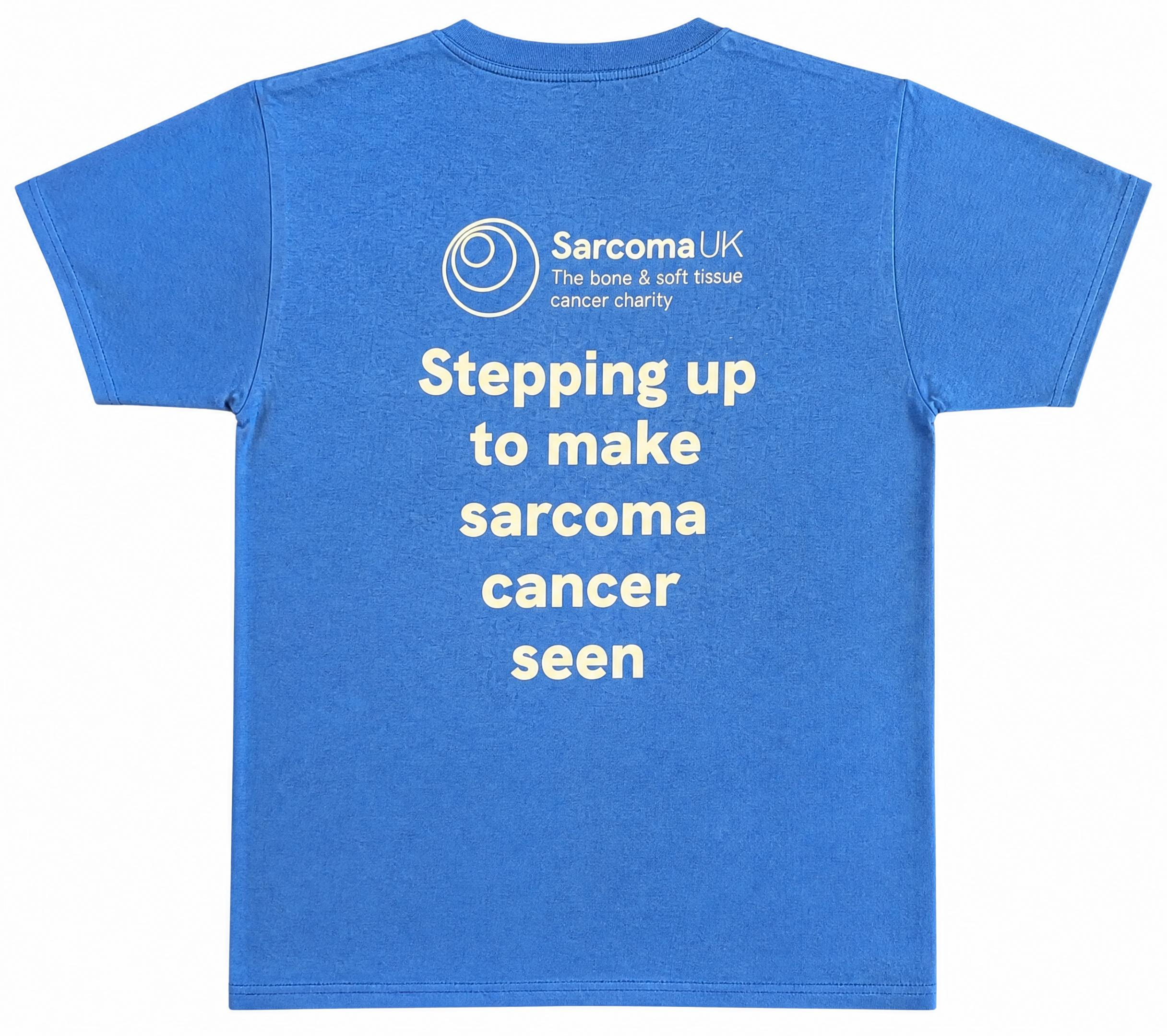Bright blue adult t-shirt featuring the text stepping up to make sarcoma cancer seen on the back, and 'RARE but REAL' printed on the front